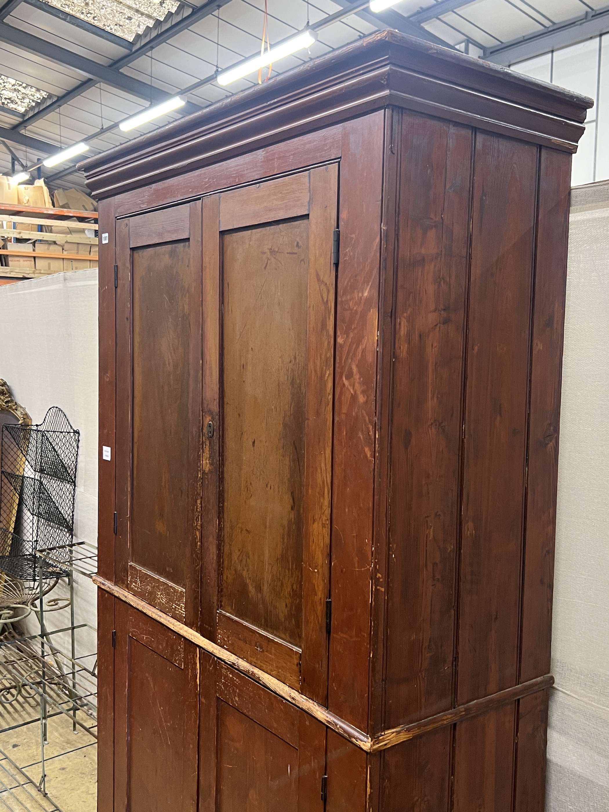 A Victorian pine four door household cupboard, width 109cm, depth 48cm, height 194cm